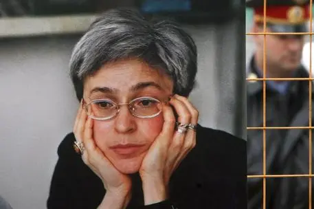 Portrait of Russian journalist Anna Politkovskaya is seen at a memorial photo exhibition in one of Moscow parks, 07 October 2007. Anna Politkovskaya, a critic of Russian authorities and human rights defender, was killed near the entrance of her house one year ago. ANSA/SERGEI CHIRIKOV